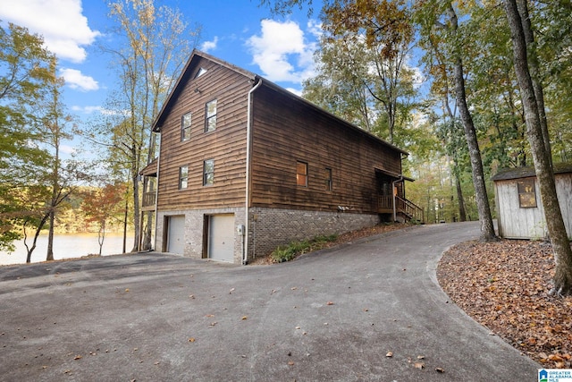 view of side of home featuring a garage