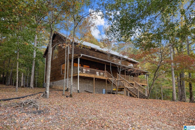 rear view of property with a deck