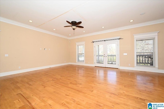 unfurnished living room featuring ceiling fan, light hardwood / wood-style flooring, and ornamental molding