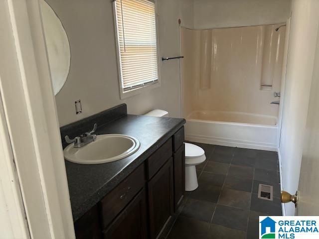 full bathroom with toilet, washtub / shower combination, and vanity