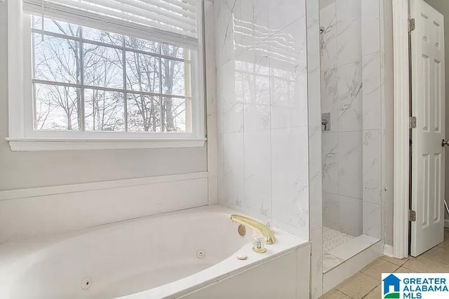 bathroom featuring tile patterned floors and separate shower and tub