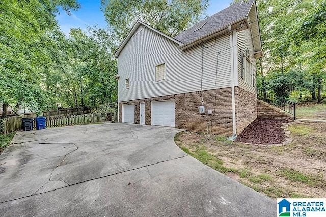 view of property exterior with a garage