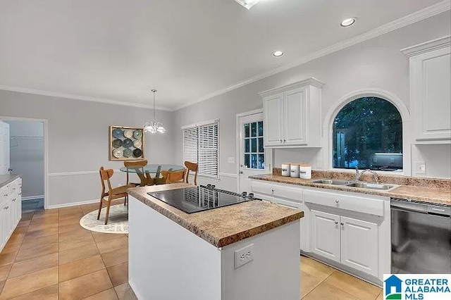 kitchen with sink, hanging light fixtures, a kitchen island, white cabinets, and black appliances