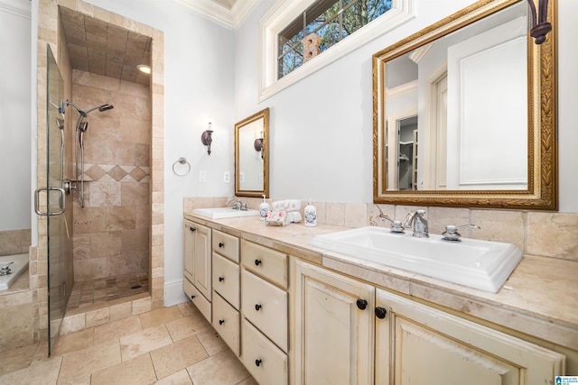 bathroom featuring vanity, a shower with shower door, and crown molding