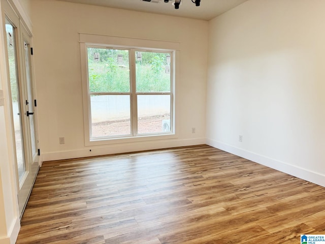 spare room featuring light hardwood / wood-style flooring