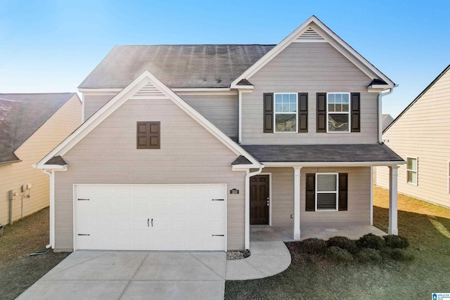 craftsman inspired home with a front yard and a garage