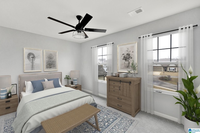 bedroom featuring ceiling fan and light carpet