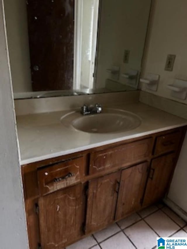 bathroom featuring vanity and tile patterned flooring