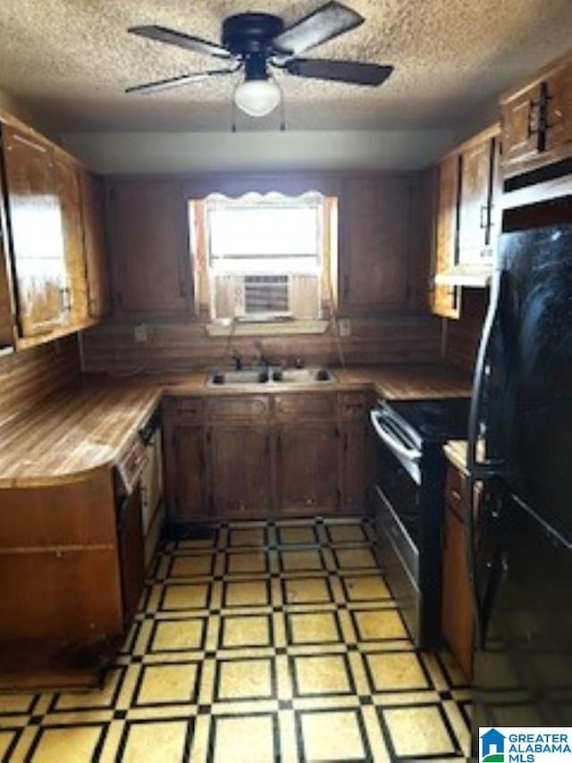 kitchen with range with electric stovetop, a textured ceiling, cooling unit, and ceiling fan