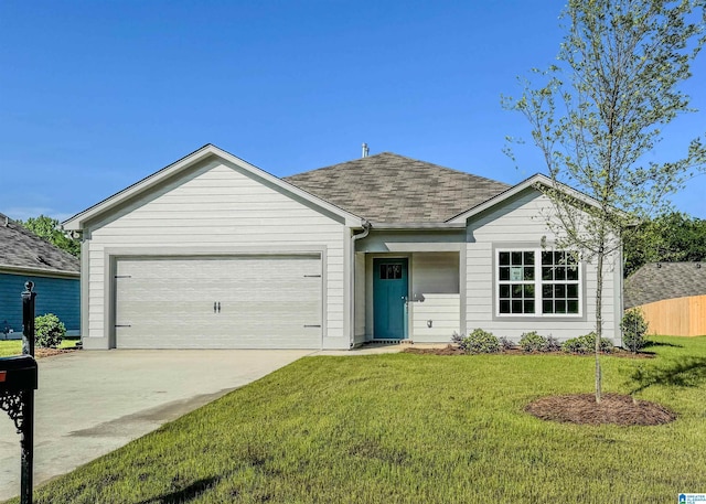 ranch-style home with a garage and a front lawn