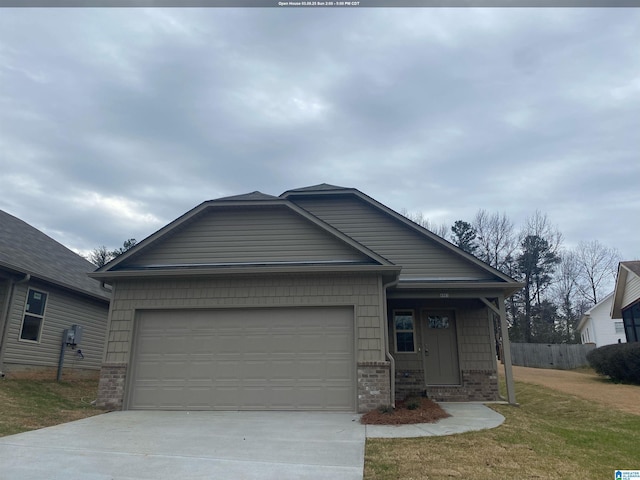 view of front of property featuring brick siding, driveway, fence, and an attached garage