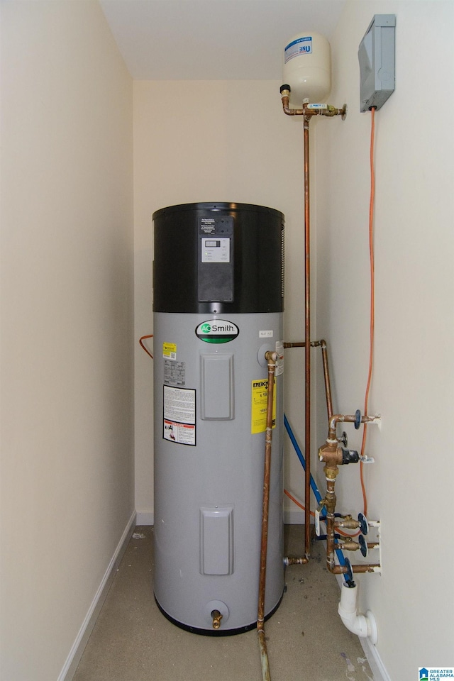utility room featuring hybrid water heater
