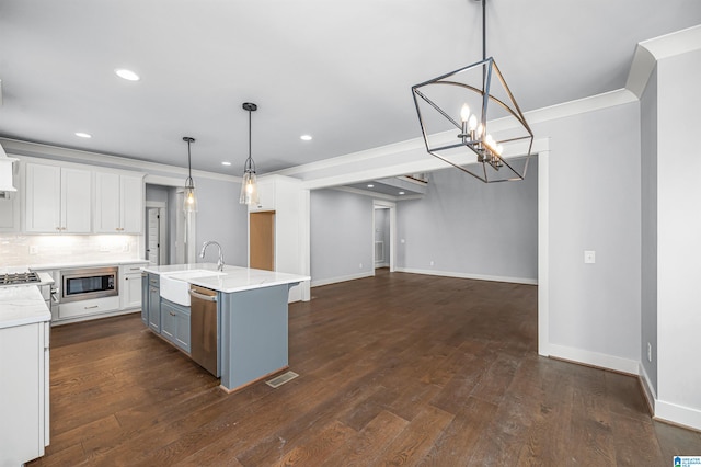 kitchen featuring decorative backsplash, dark hardwood / wood-style floors, stainless steel appliances, and white cabinets