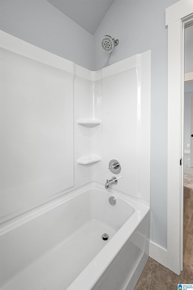 bathroom featuring tile patterned flooring and shower / washtub combination