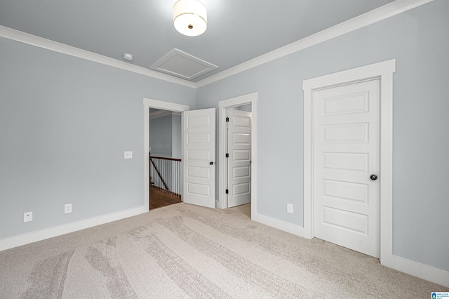 unfurnished bedroom featuring ornamental molding and carpet