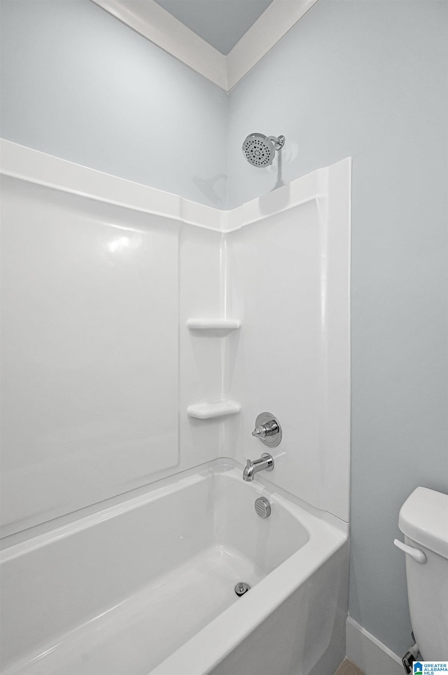 bathroom with toilet and bathtub / shower combination