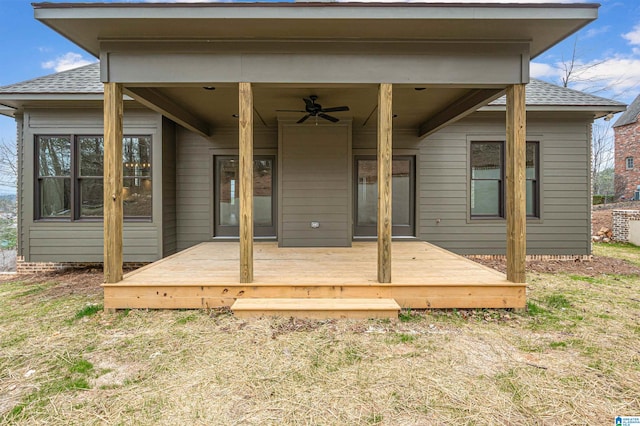 exterior space with ceiling fan and a wooden deck