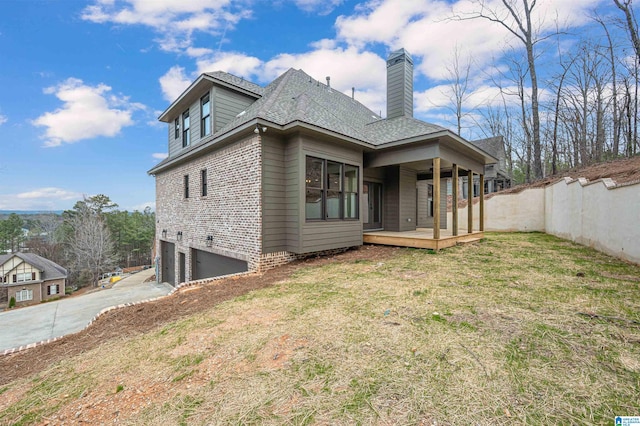 view of front of home featuring a garage and a front lawn