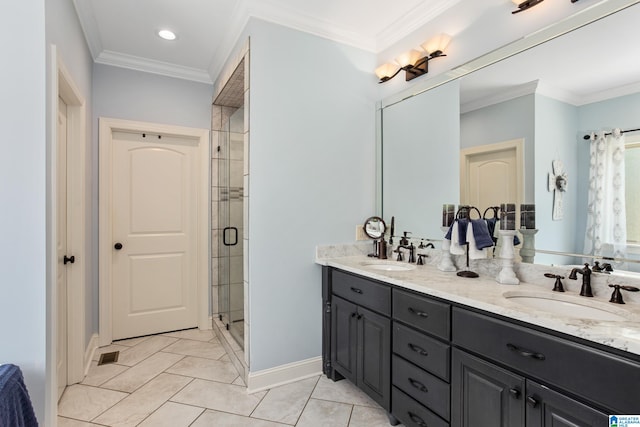 bathroom with tile patterned flooring, vanity, a shower with door, and crown molding