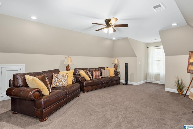 living room featuring carpet flooring, ceiling fan, and lofted ceiling