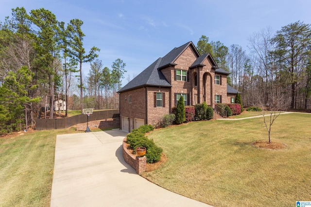 view of front of house featuring a front yard and a garage