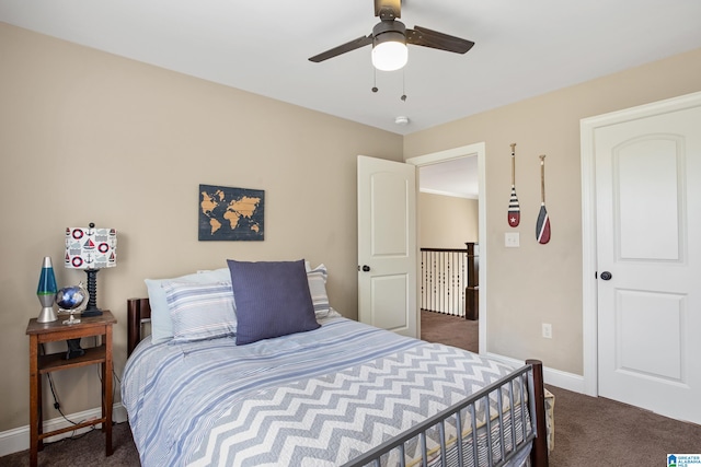 bedroom with ceiling fan and dark carpet