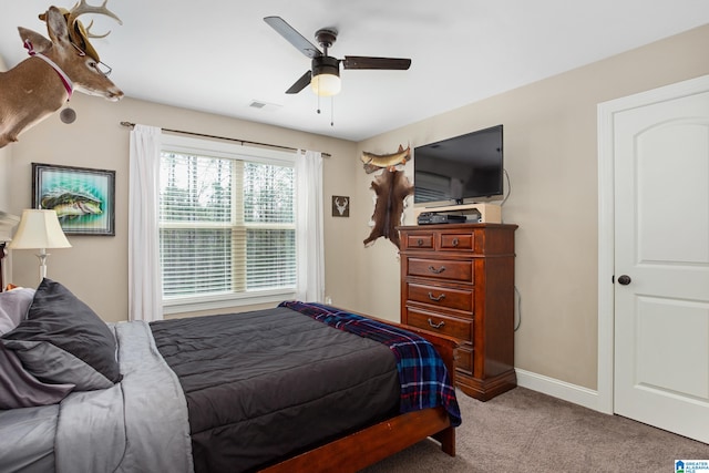 carpeted bedroom featuring ceiling fan