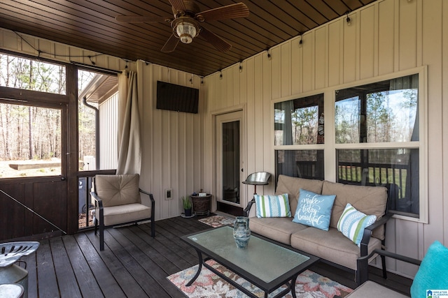 sunroom with ceiling fan and wood ceiling