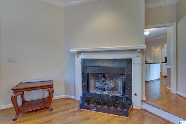 details featuring wood-type flooring and crown molding