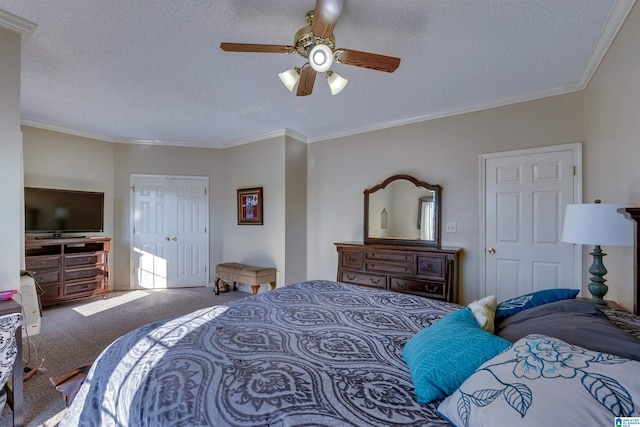 bedroom featuring ceiling fan, carpet floors, a textured ceiling, and ornamental molding