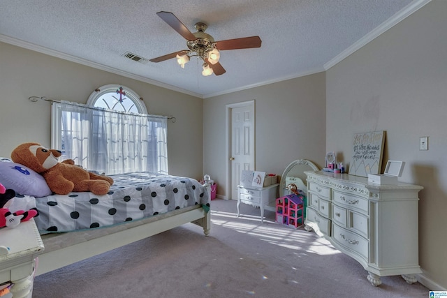 carpeted bedroom featuring ceiling fan, ornamental molding, and a textured ceiling