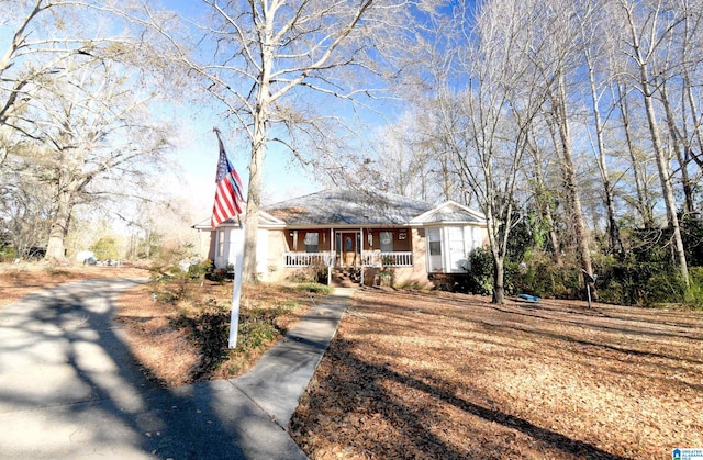 421 County Road 764, Clanton, AL 35046 - view of front of house featuring covered porch and stucco siding