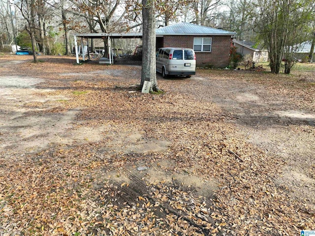 421 County Road 764, Clanton, AL 35046 - view of yard featuring a carport