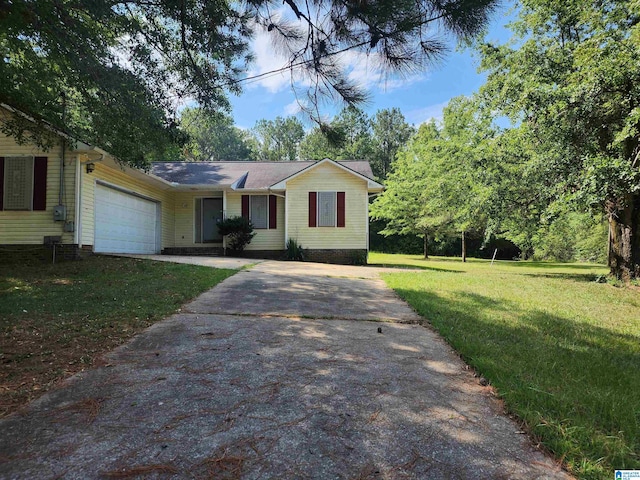 ranch-style house with a garage and a front lawn