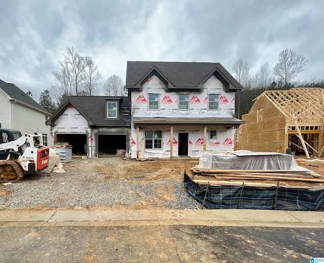 unfinished property with a garage