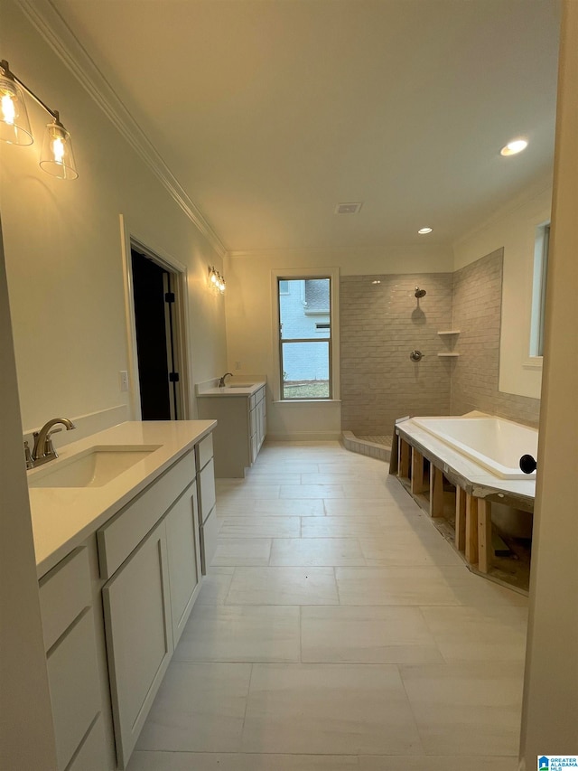 bathroom with ornamental molding, separate shower and tub, tile floors, and vanity