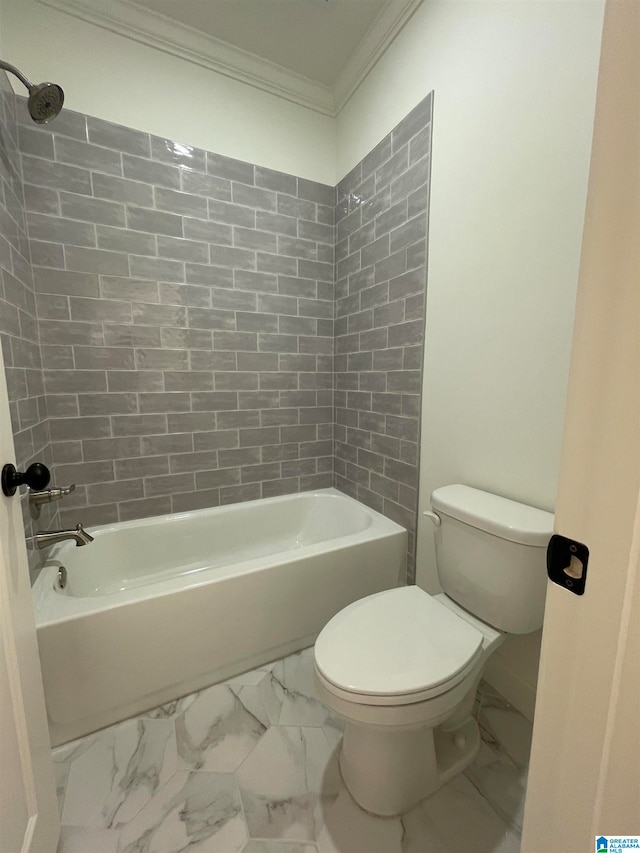 bathroom with crown molding, tiled shower / bath combo, tile floors, and toilet