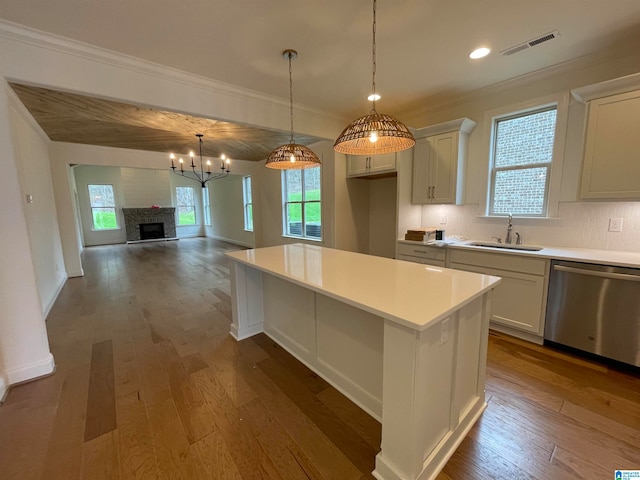 kitchen with white cabinetry, tasteful backsplash, dishwasher, and dark hardwood / wood-style floors