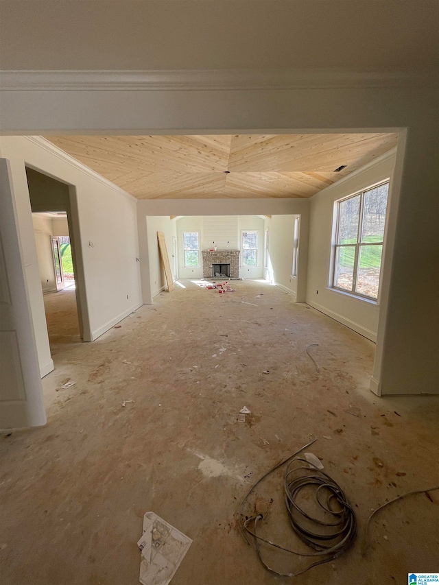 empty room with ornamental molding and plenty of natural light