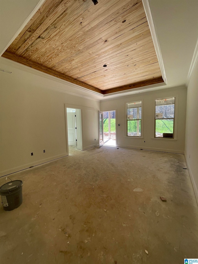 unfurnished room featuring wood ceiling, ornamental molding, and a raised ceiling