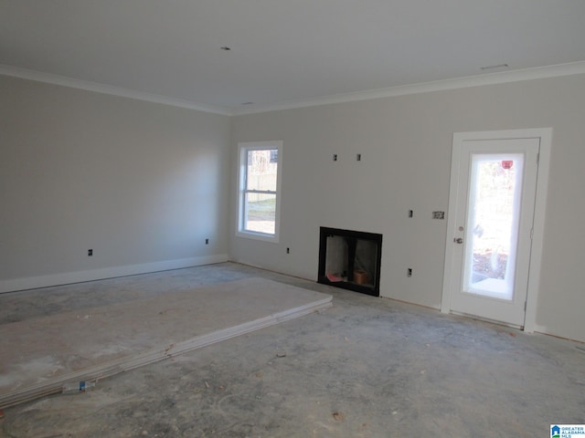 unfurnished living room with crown molding and plenty of natural light