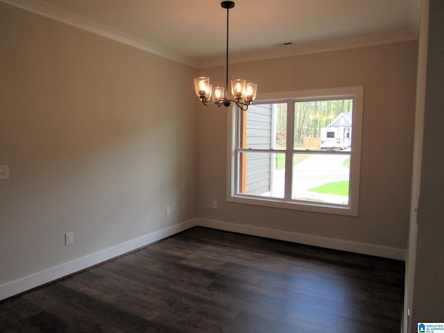 unfurnished room featuring a notable chandelier, crown molding, and dark wood-type flooring