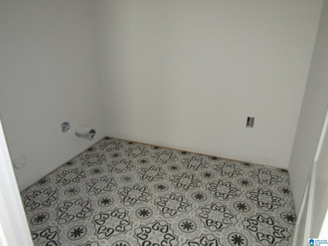 laundry room with tile flooring