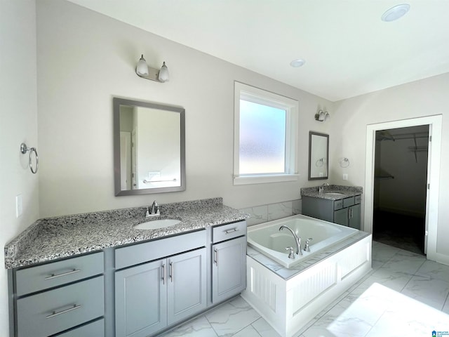 bathroom featuring vanity and a bathing tub