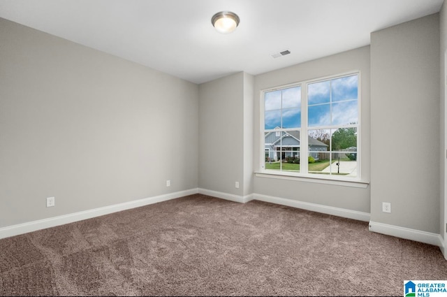 unfurnished room with carpet floors