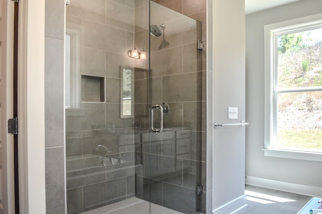 bathroom featuring an enclosed shower