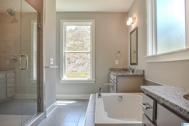 bathroom with vanity, tile patterned floors, and separate shower and tub