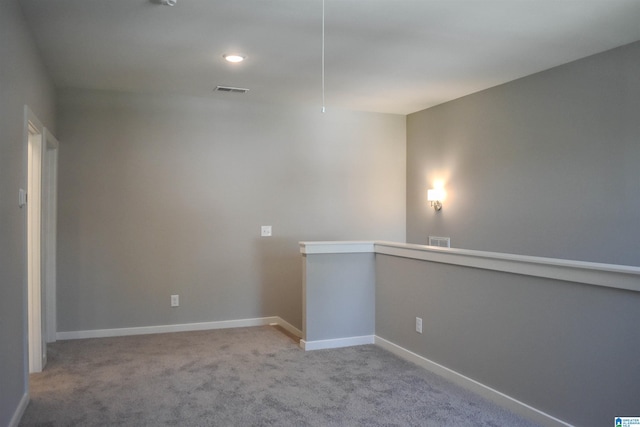 empty room featuring light carpet