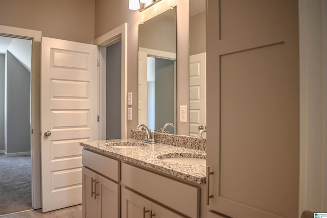 bathroom featuring vanity and wood-type flooring