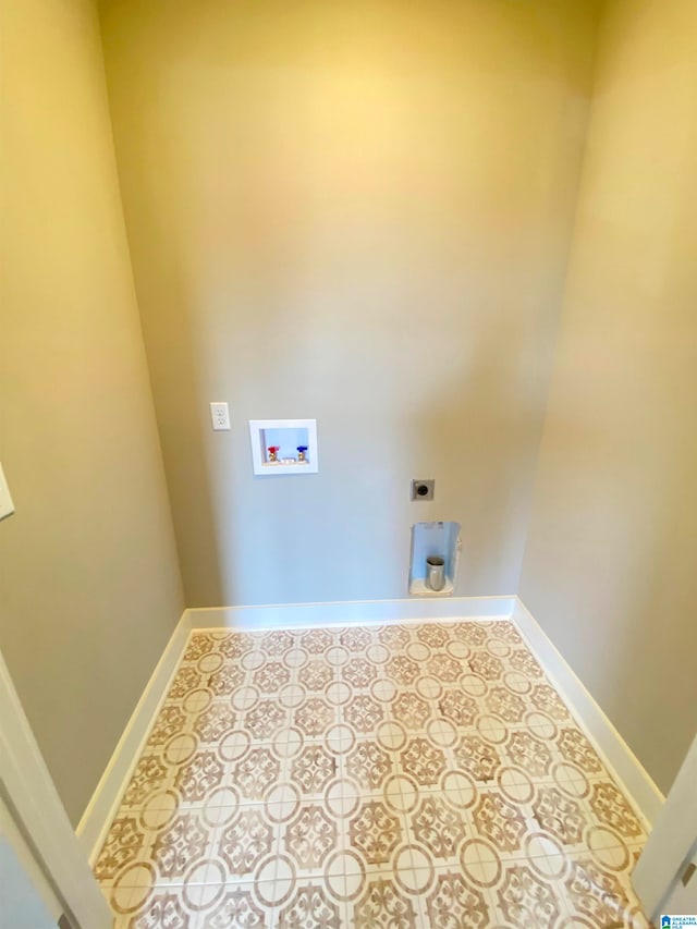 washroom with hookup for an electric dryer, hookup for a washing machine, and tile flooring